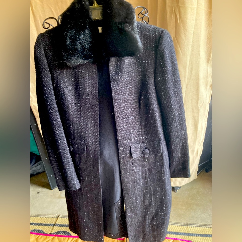 Calf length black jacket with fur collar, size 10